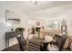 Dining area flowing into living room with hardwood floors and natural light at 13020 E Linvale Pl, Aurora, CO 80014
