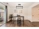 Dining area features stylish lighting, seating for two, and access to the outdoors at 13020 E Linvale Pl, Aurora, CO 80014