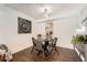 Dining area with table, chairs, and decorative sunflower art at 13020 E Linvale Pl, Aurora, CO 80014