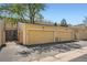 Detached garages with yellow doors for convenient parking and storage at 13020 E Linvale Pl, Aurora, CO 80014