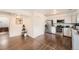 Well-lit kitchen featuring stainless steel appliances and ample cabinet space at 13020 E Linvale Pl, Aurora, CO 80014