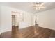 Open-concept main bedroom with ceiling fan, walk-in closet, and en suite bathroom at 13020 E Linvale Pl, Aurora, CO 80014