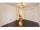 Bedroom with hardwood floors features closet and door leading to stairs at 9821 Rock Dove Ln, Highlands Ranch, CO 80129