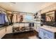 Spacious closet with open shelving and drawer systems, complemented by stylish lighting and a sleek vanity at 9821 Rock Dove Ln, Highlands Ranch, CO 80129