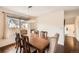 Elegant dining room features a large wooden table, comfortable chairs, and a stylish chandelier for a warm ambiance at 9821 Rock Dove Ln, Highlands Ranch, CO 80129