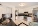 Bright kitchen with stainless steel appliances, sleek countertops, and a cozy breakfast nook for casual dining at 9821 Rock Dove Ln, Highlands Ranch, CO 80129