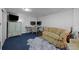 Basement living space with carpet, work space, and seating area at 1429 Hudson St, Denver, CO 80220
