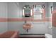 Bathroom with pink sink and tub and white tile at 1429 Hudson St, Denver, CO 80220