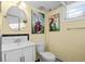 Bright bathroom featuring a pedestal sink and unique art decorations at 1429 Hudson St, Denver, CO 80220