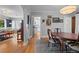 Open-concept living and dining area showcasing hardwood floors and neutral walls at 1429 Hudson St, Denver, CO 80220