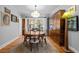 Charming dining room with hardwood floors, a vintage rug, and a classic wooden table at 1429 Hudson St, Denver, CO 80220