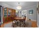 Open dining area with hardwood floors, classic furniture, and access to other rooms at 1429 Hudson St, Denver, CO 80220