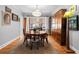 Traditional dining room features a wooden table, chairs, and a large china cabinet at 1429 Hudson St, Denver, CO 80220