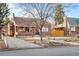 Charming brick home showcasing a covered front porch and mature landscaping for inviting curb appeal at 1429 Hudson St, Denver, CO 80220