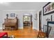 Inviting living room with hardwood floors flowing into the dining area, offering a seamless and open layout at 1429 Hudson St, Denver, CO 80220
