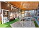 Inviting sun room with bright carpet, a table, and a wood plank ceiling at 1429 Hudson St, Denver, CO 80220