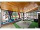 Bright sunroom featuring wood ceilings and turf style carpet at 1429 Hudson St, Denver, CO 80220