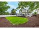 Private backyard with a spacious lawn, mature shade trees, with a deck, patio and privacy fence at 20710 E Princeton Pl, Aurora, CO 80013