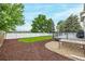Secluded backyard with a patio area, gravel detail, garden, and beautiful mature trees and plantings at 20710 E Princeton Pl, Aurora, CO 80013