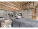 Unfinished basement with exposed ceiling, concrete walls, and exercise equipment setup at 20710 E Princeton Pl, Aurora, CO 80013