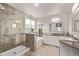 Spacious bathroom features a tiled walk-in shower, separate tub, and a dual sink vanity at 20710 E Princeton Pl, Aurora, CO 80013