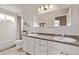 Bright bathroom with double sinks, large mirror, and tub shower, offering ample space and style at 20710 E Princeton Pl, Aurora, CO 80013