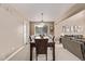 Formal dining room featuring a large window and neutral color scheme at 20710 E Princeton Pl, Aurora, CO 80013