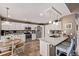 Well-equipped kitchen with stainless appliances, white cabinetry, and breakfast area with natural light at 20710 E Princeton Pl, Aurora, CO 80013