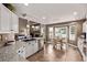 Bright and airy kitchen with stainless appliances, granite counters, breakfast nook and fireplace views at 20710 E Princeton Pl, Aurora, CO 80013