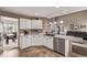 Gourmet kitchen with stone countertops, stainless steel appliances, and stylish cabinetry at 20710 E Princeton Pl, Aurora, CO 80013