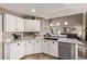 Modern kitchen featuring granite countertops, stainless steel appliances, and open layout at 20710 E Princeton Pl, Aurora, CO 80013