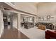 Open-concept living area with high ceilings, neutral tones, and hardwood floors at 20710 E Princeton Pl, Aurora, CO 80013