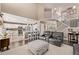 Modern living space with open floor plan, white cabinets, and a breakfast bar at 20710 E Princeton Pl, Aurora, CO 80013