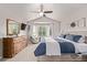 Bright main bedroom featuring a ceiling fan, bay window, and neutral color palette at 20710 E Princeton Pl, Aurora, CO 80013