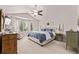 Bright main bedroom with vaulted ceilings, ceiling fan, and a large bay window at 20710 E Princeton Pl, Aurora, CO 80013