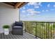 Relaxing balcony with a comfortable chair and scenic views of the surrounding landscape at 485 Interlocken Blvd # 201, Broomfield, CO 80021