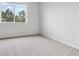 Bedroom with a window, carpeted flooring, and neutral walls at 485 Interlocken Blvd # 201, Broomfield, CO 80021