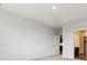 Bedroom view showcasing neutral colors, carpeted floors, and an attached bathroom at 485 Interlocken Blvd # 201, Broomfield, CO 80021