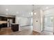 Open floor plan with kitchen island, stainless appliances, and access to the living space at 485 Interlocken Blvd # 201, Broomfield, CO 80021