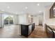 Kitchen island overlooks a spacious open-concept living area and balcony at 485 Interlocken Blvd # 201, Broomfield, CO 80021