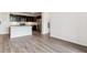 Modern kitchen featuring stainless steel appliances, dark cabinets, and a large island with breakfast bar at 485 Interlocken Blvd # 201, Broomfield, CO 80021