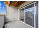 Private patio with wood ceiling, sliding glass doors, and views of the community at 485 Interlocken Blvd # 201, Broomfield, CO 80021