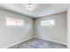 This bedroom features neutral walls, carpet, base molding, and windows at 9141 Gail Ct, Thornton, CO 80229