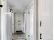 This hallway features white shaker cabinetry and black modern hardware at 9141 Gail Ct, Thornton, CO 80229