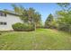 Large backyard surrounded by mature trees, offering privacy and shade at 1800 Centaur Village Dr, Lafayette, CO 80026