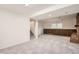 View of the finished basement featuring neutral carpet and a brick fireplace at 1800 Centaur Village Dr, Lafayette, CO 80026