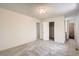 Spacious bedroom with multiple doorways, neutral walls, soft carpeting, and ample closet space at 1800 Centaur Village Dr, Lafayette, CO 80026