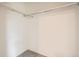 Empty walk-in closet with neutral walls and basic shelving, ready for customization and organization at 1800 Centaur Village Dr, Lafayette, CO 80026