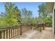 Spacious deck with wood railings overlooking a lush backyard at 1800 Centaur Village Dr, Lafayette, CO 80026