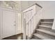 Bright entryway with a staircase, closet, and tile flooring adjacent to the front door at 1800 Centaur Village Dr, Lafayette, CO 80026